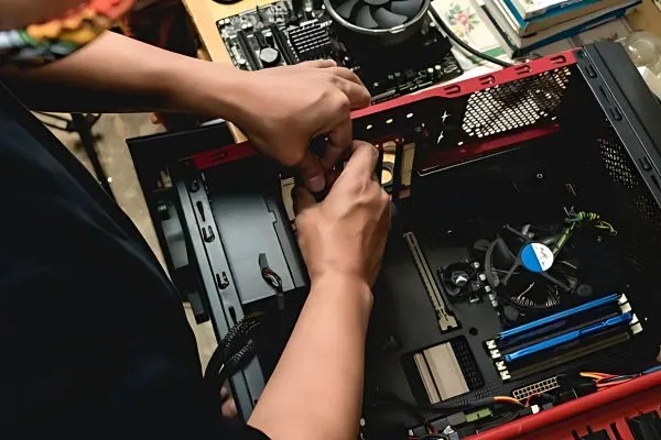 Technician assembling a high-performance prebuilt gaming PC - shop ready-to-use systems at JNXPC UK